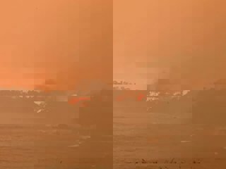 Malua Bay wildfire and a smoke-filled sky