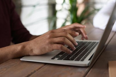 Person typing on a laptop
