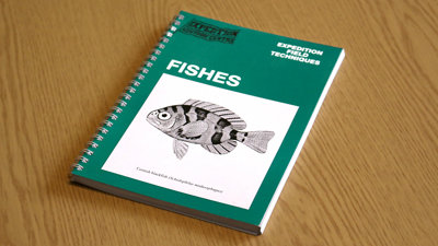A copy of Expedition Field Techniques: Fishes on a desk.