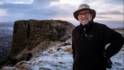 Cormac Hamill standing on Cave Hill. 