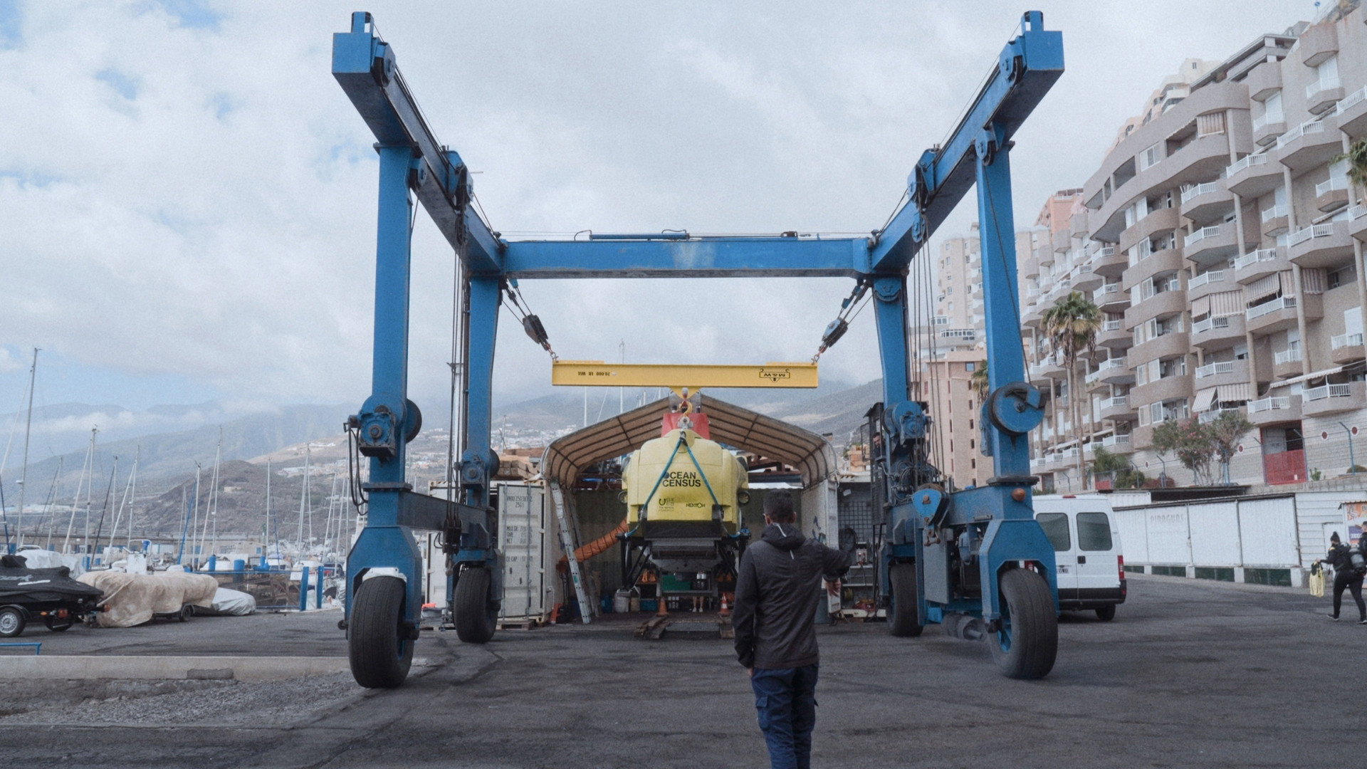 Ocean Census submarine being moved by crane.
