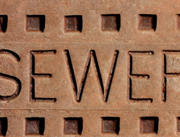 Red brick with the word sewer