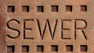 Red brick with the word sewer