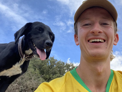 Tommy with a black and white dog