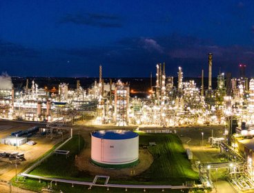 An oil refinery lit up at night.