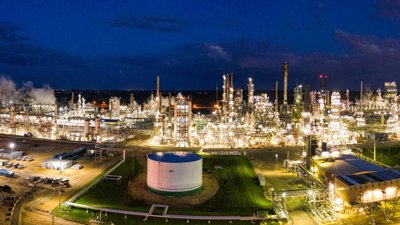 An oil refinery lit up at night.