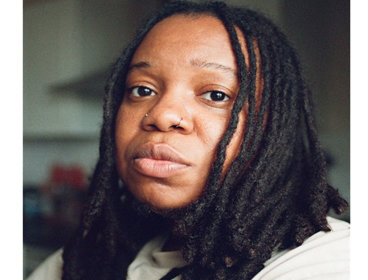 Headshot of a Exodus Crooks with a blurred background.
