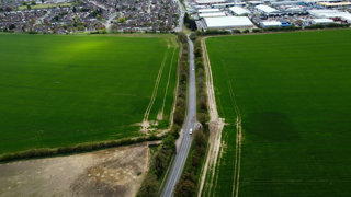 A modern building development up against the green belt