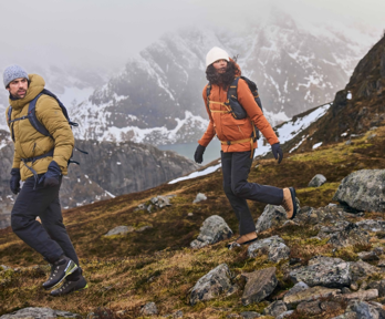 Two people hiking in snowy landscape