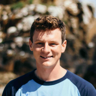 Portrait photo of Alexander Mcmaster with blurred out background.