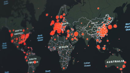 Red circles depicting data on a digital world map.