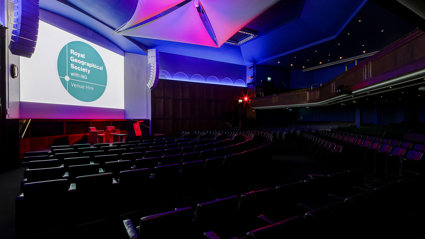 A side-shot of the Ondaatje Lecture Theatre with dark lighting.