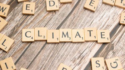 Scrabble pieces spelling out climate.