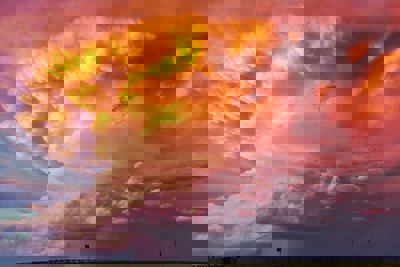 Orange and purple tinted clouds on a stormy day