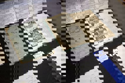 Display of historic materials including printed journal volumes