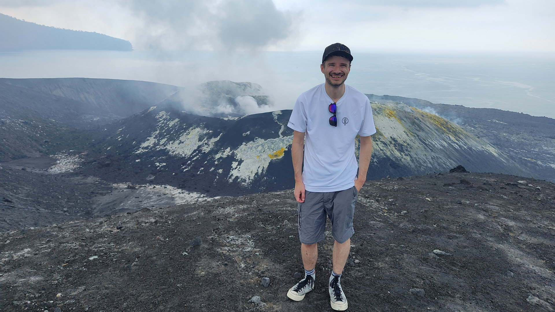 Person standing by a volcano.