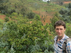Photo showing Nathan with eucalyptus growing in Rwanda