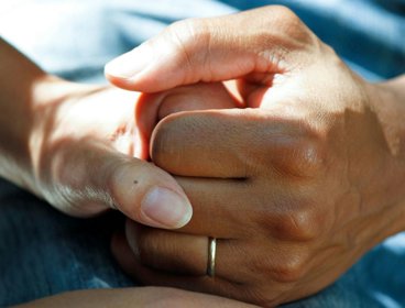 Hands holding each other.