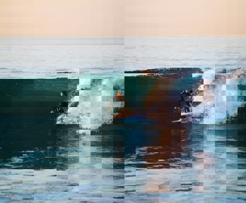 Man surfing on an ocean wave
