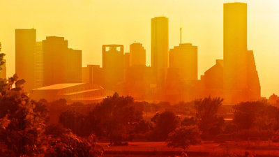 A hazy view over Houston, with the city pictured yellow in the heat and dust