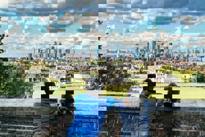 Two people looking out over the view of Greenwich and London
