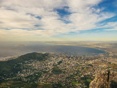 Aerial view of Cape Town, South Africa under a blue sky.