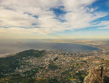 Aerial view of Cape Town, South Africa under a blue sky.