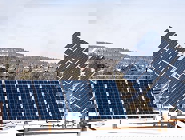Solar panels sitting on a roof