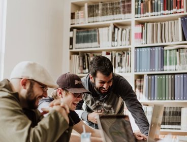 Group laughing during discussion.