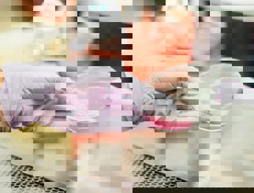 Gloved hands holding a petri dish