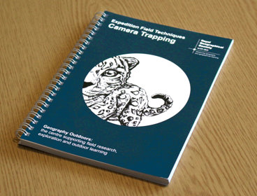 A copy of Expedition Field Techniques: Camera Trapping on a desk.