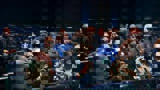 Audience member asking question in Ondaatje Theatre.