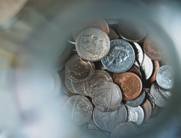 Sterling coins in a jar. 
