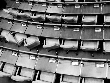 Aerial view of voting tables in a parlimentary building.