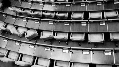 Aerial view of voting tables in a parlimentary building.