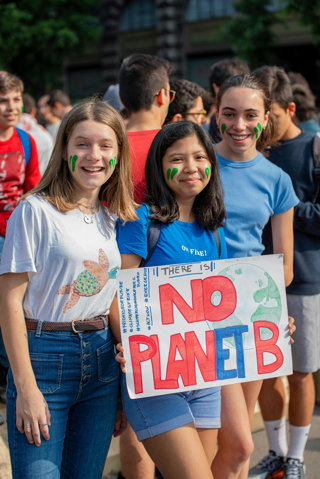 Children holding a placard that reads 'there is no planet B'