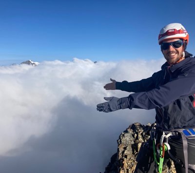 Felix de Montety above the clouds atop a mountain