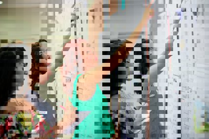 People looking at a board