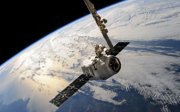 A satellite in space facing Earth. 