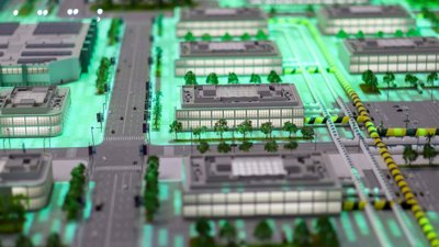 Computer generated model of a city with buildings, roads and trees