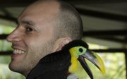 Alexandre Antonelli Fieldwork In Colombia with a bird on his shoulder.