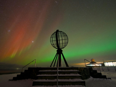 Arctic science station with northern lights