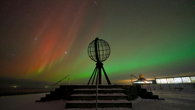Arctic science station with northern lights