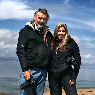 Chris Rainier holding a camera (left) and Olivia McKendrick (right).