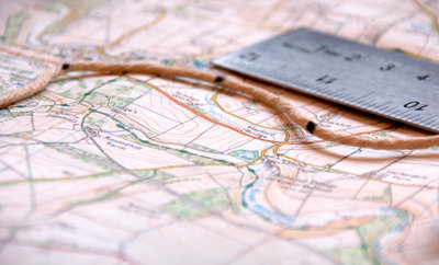 Map, ruler and string