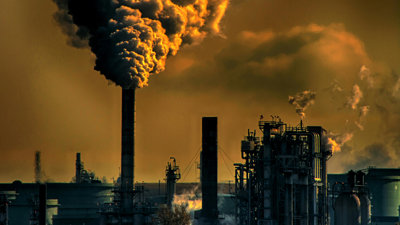 Factories belching out smoke.