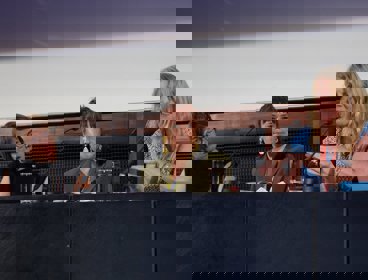 Three speakers on a conference panel.