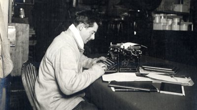 Apsley Cherry-Garrard and his typewriter on board the Terra Nova British Antarctic Expedition.