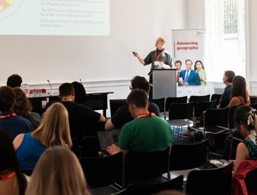 Person giving lecture to audience at RGS Annual Conference. 