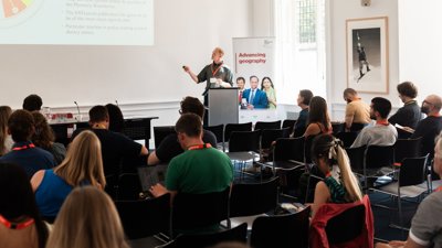 Person giving lecture to audience at RGS Annual Conference. 
